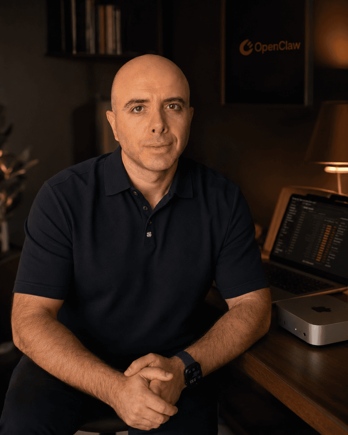 Hovhannes Hunanyan in a warm workspace with private AI infrastructure